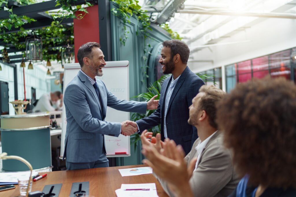 Business male partnership handshake. Photo handshaking process. Successful deal after meeting