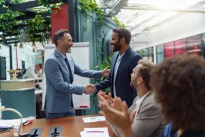 Business male partnership handshake. Photo handshaking process. Successful deal after meeting