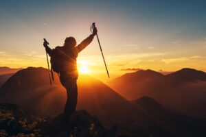mountaineer man making summit
